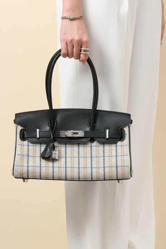 Elegance Redefined: Quilted Craftsmanship with Gold Accents